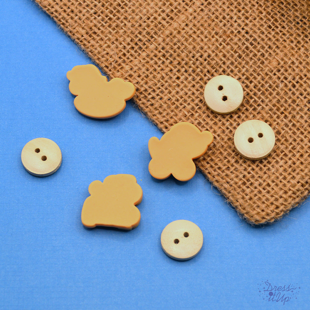 Features a train, rocking horse and wheely dog perfect for nursery projects. Flat-back and sew through embellishments