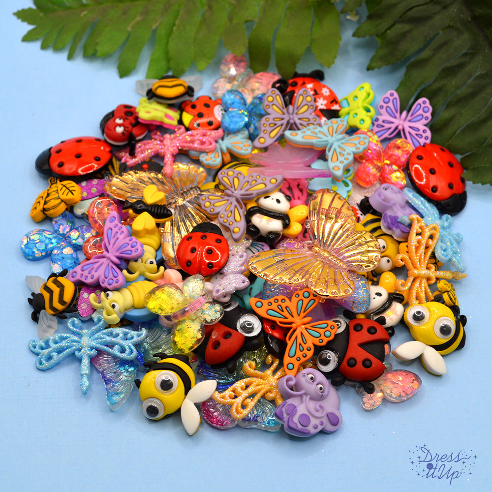 assortment of big and butterfly themed crafting embellishments