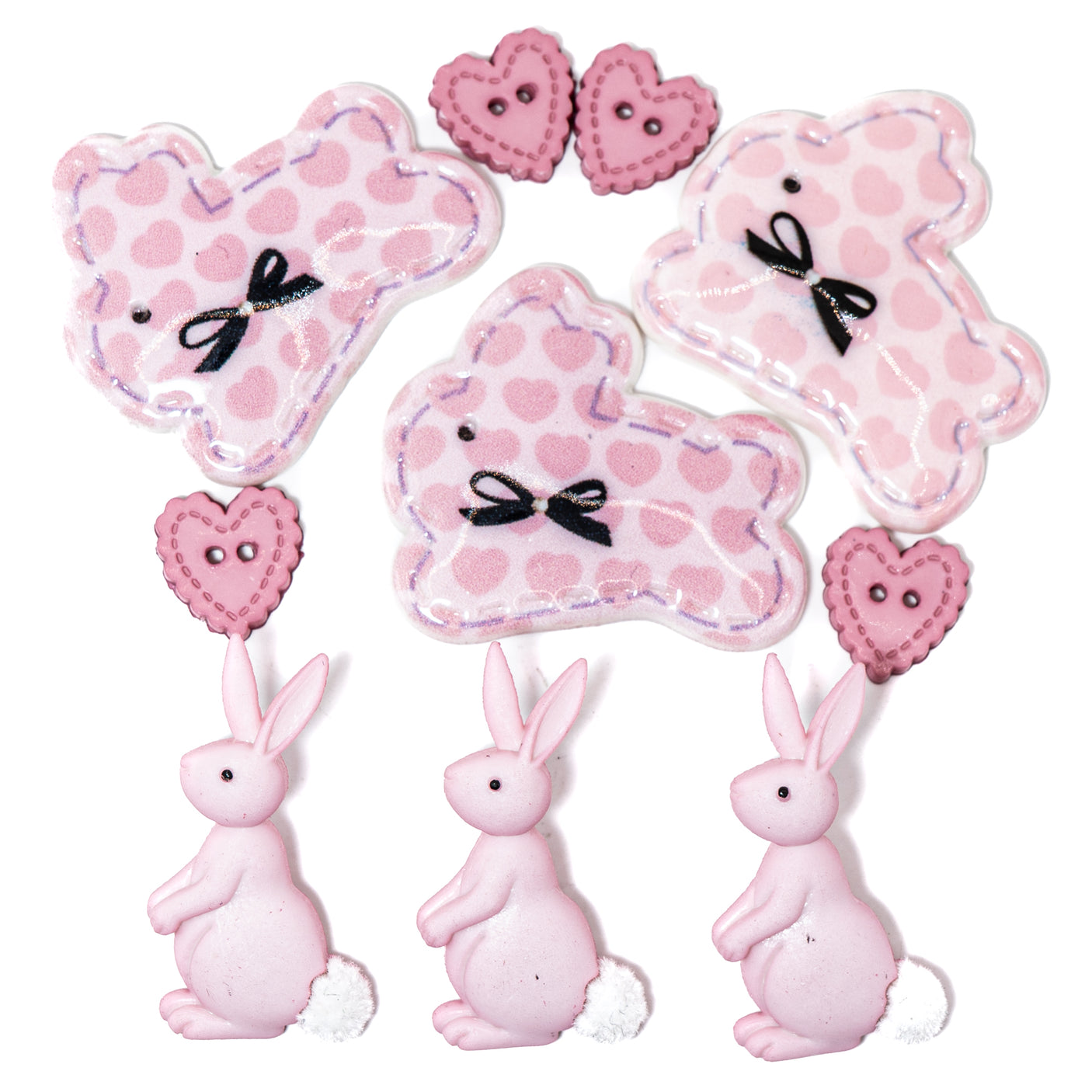 Pink bunnies craft embellishments and sew thru hearts on a white background