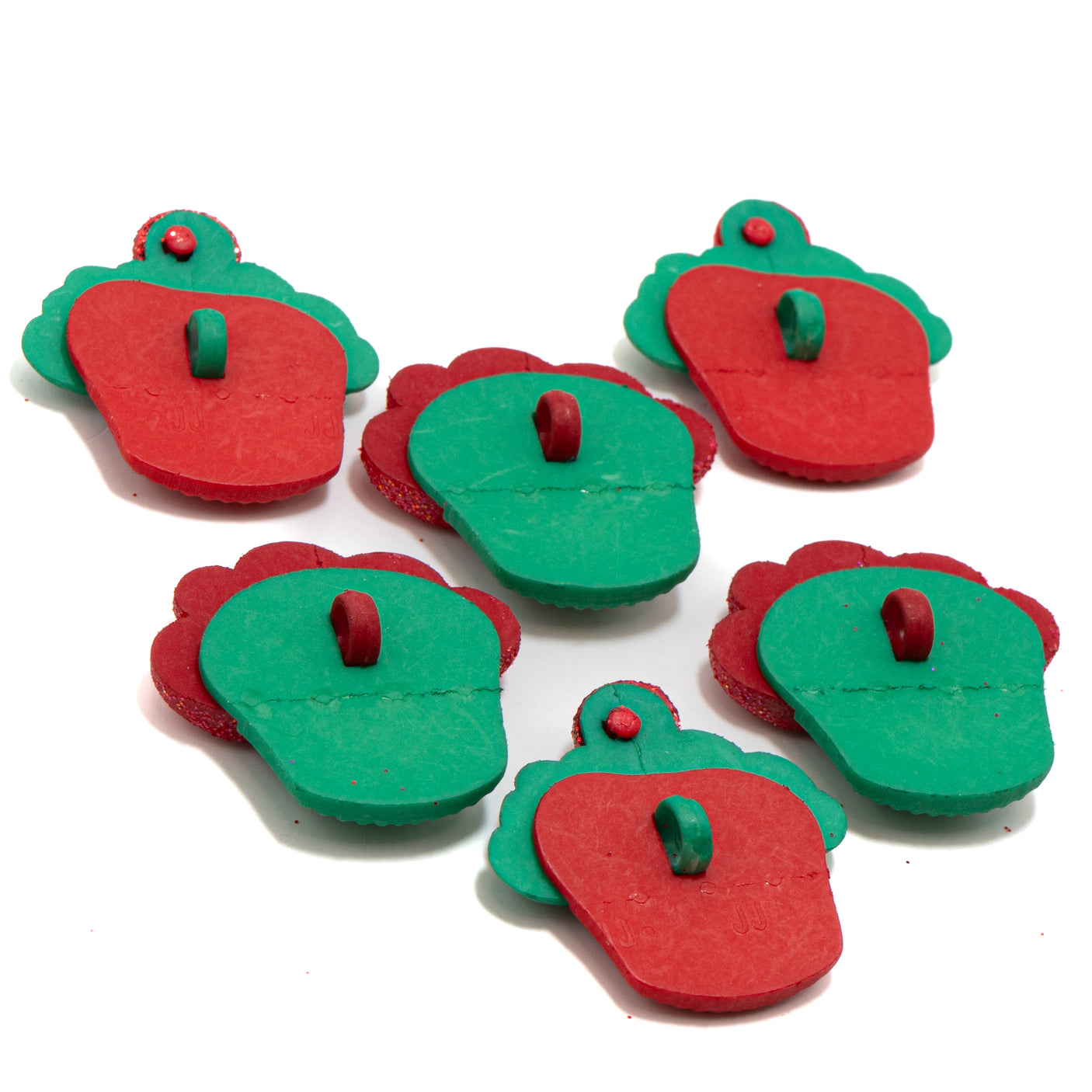 Red and green cupcake-shaped buttons on a white background