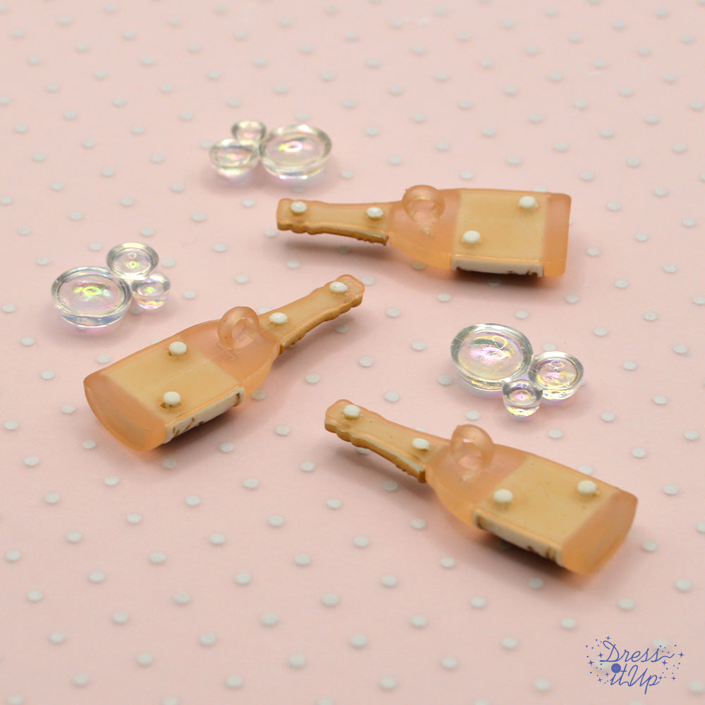 Create crafts that celebrate with gold champagne bottles and shiny bubbles, flat-back embellishments
