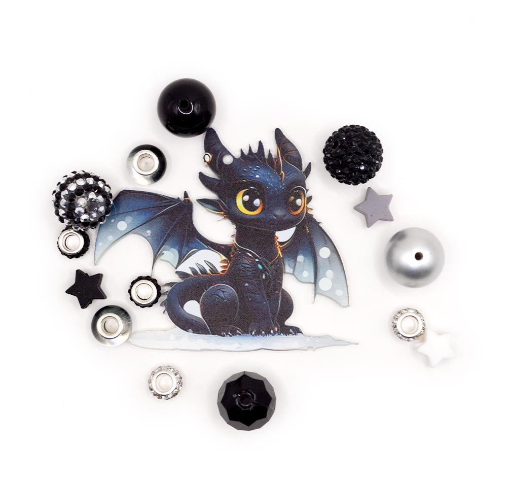 Assortment of silicone black and white dragon themed beads with charms.
