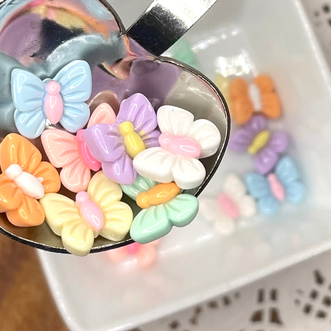Pretty pastel butterfly embellishments add to children's room decor and spring crafts