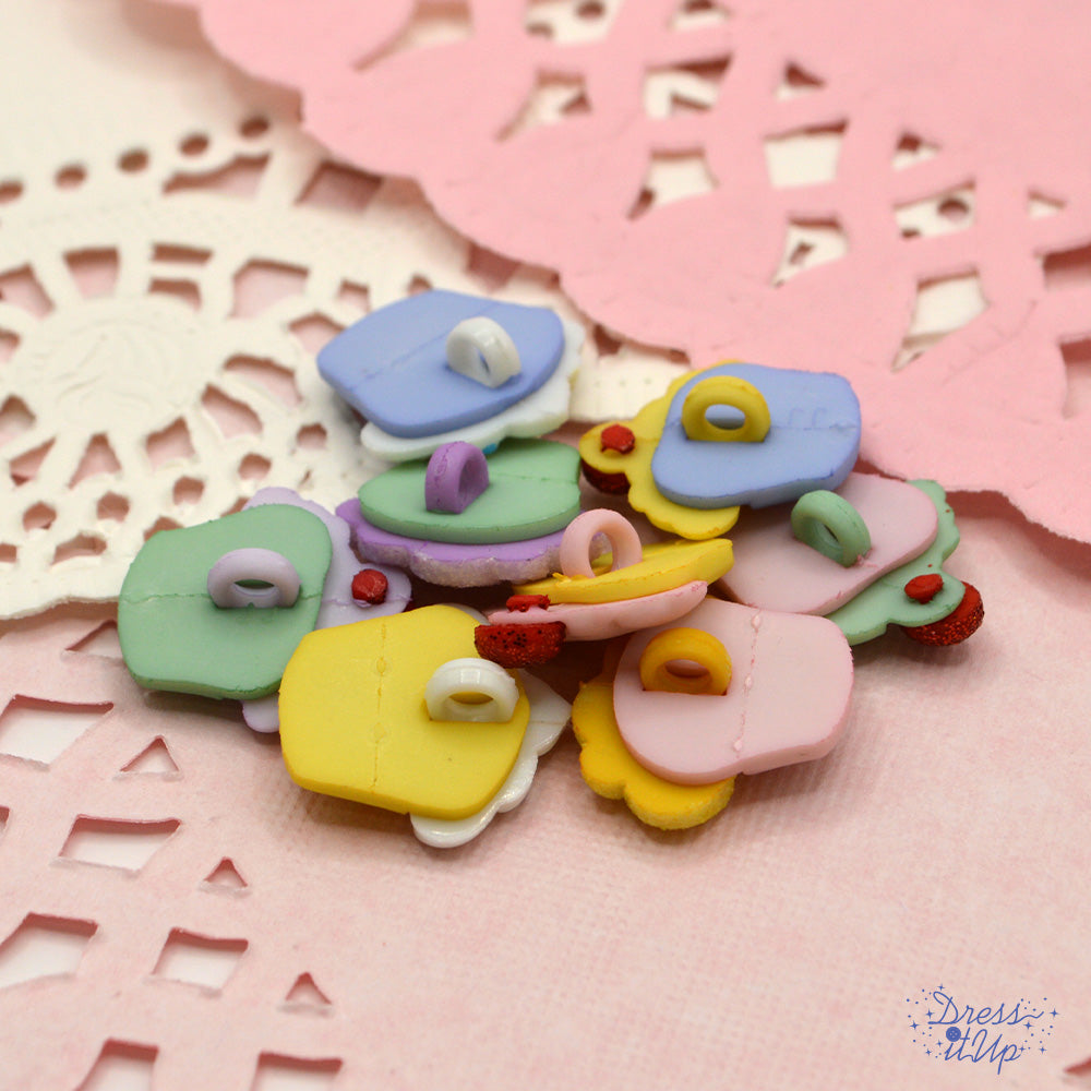 Mini pastel cupcakes showing shank-back buttons