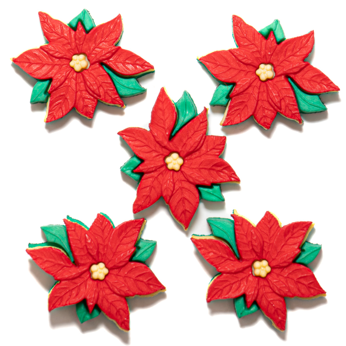 Five red poinsettia flower buttons with green leaves on a white background