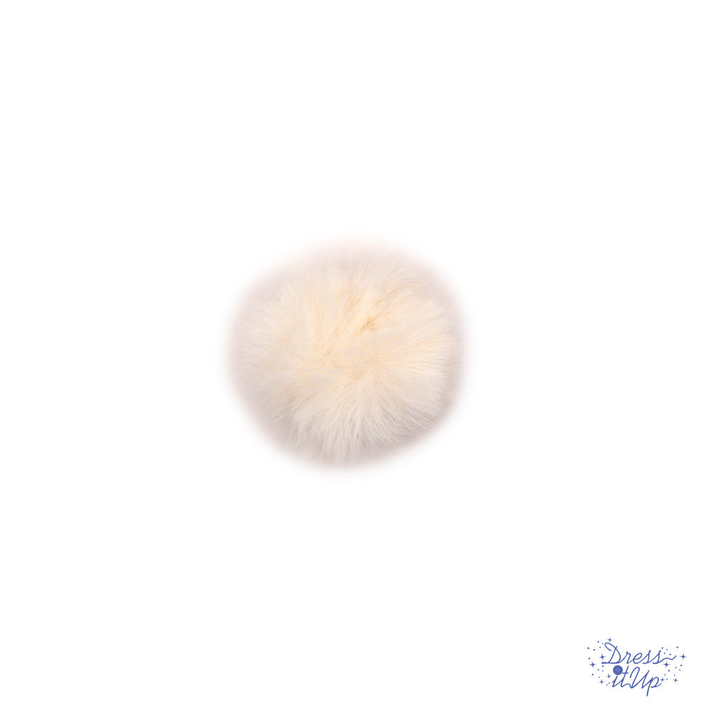 Add a white pom pom to bag charms and keychains