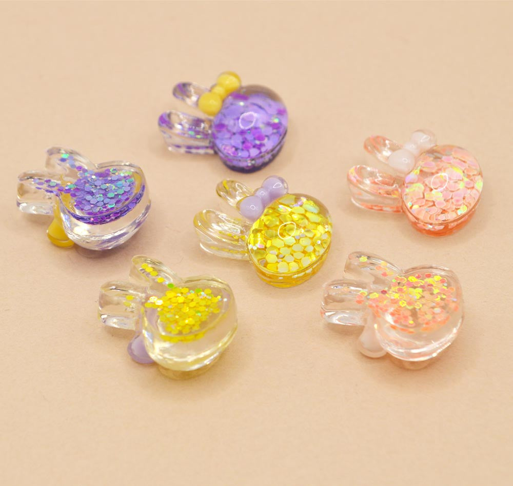 Glittery bunnies with hair bows for diy crafting