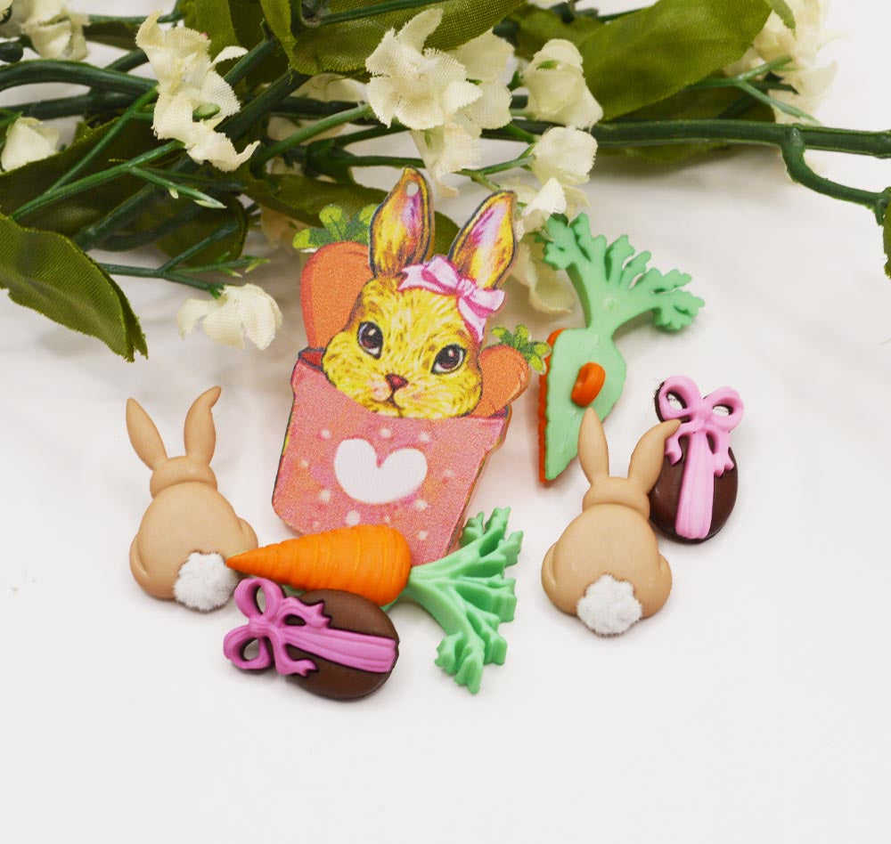An assortment of Easter-themed buttons and charms for crafting