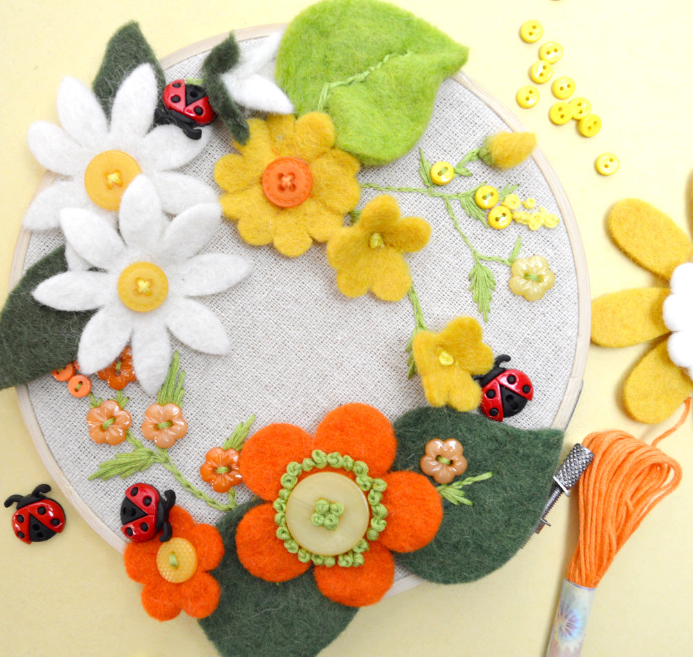 Project featuring felt, with ladybugs and tiny sew-thru buttons