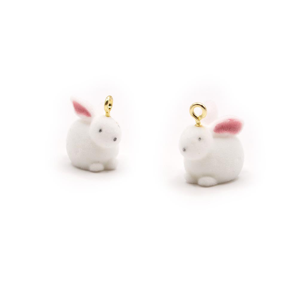 a pair of white flocked bunnies for easter crafting and jewelry making