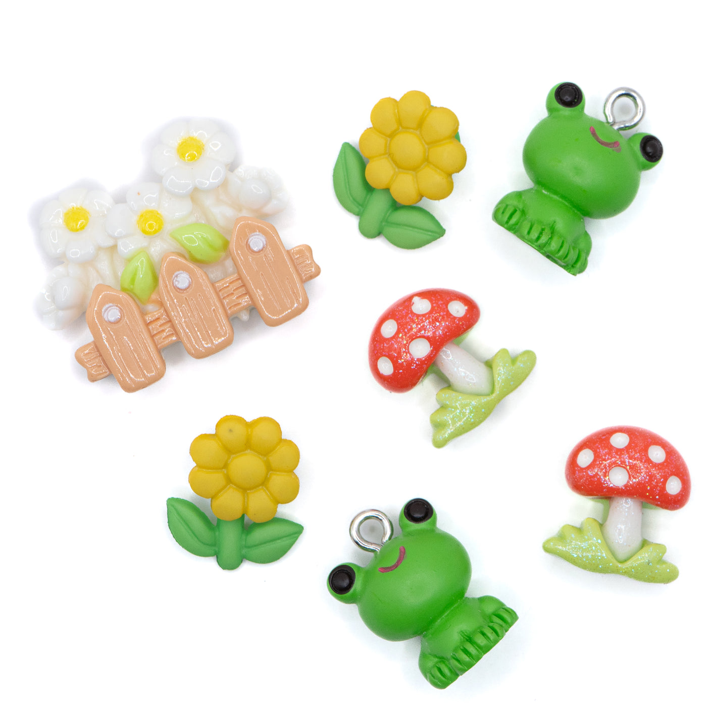 This pack includes two frog charms, daisies, and toadstools in shank-back and flat-back styles. 7 pieces Includes charms, shank-back, and flat-back styles