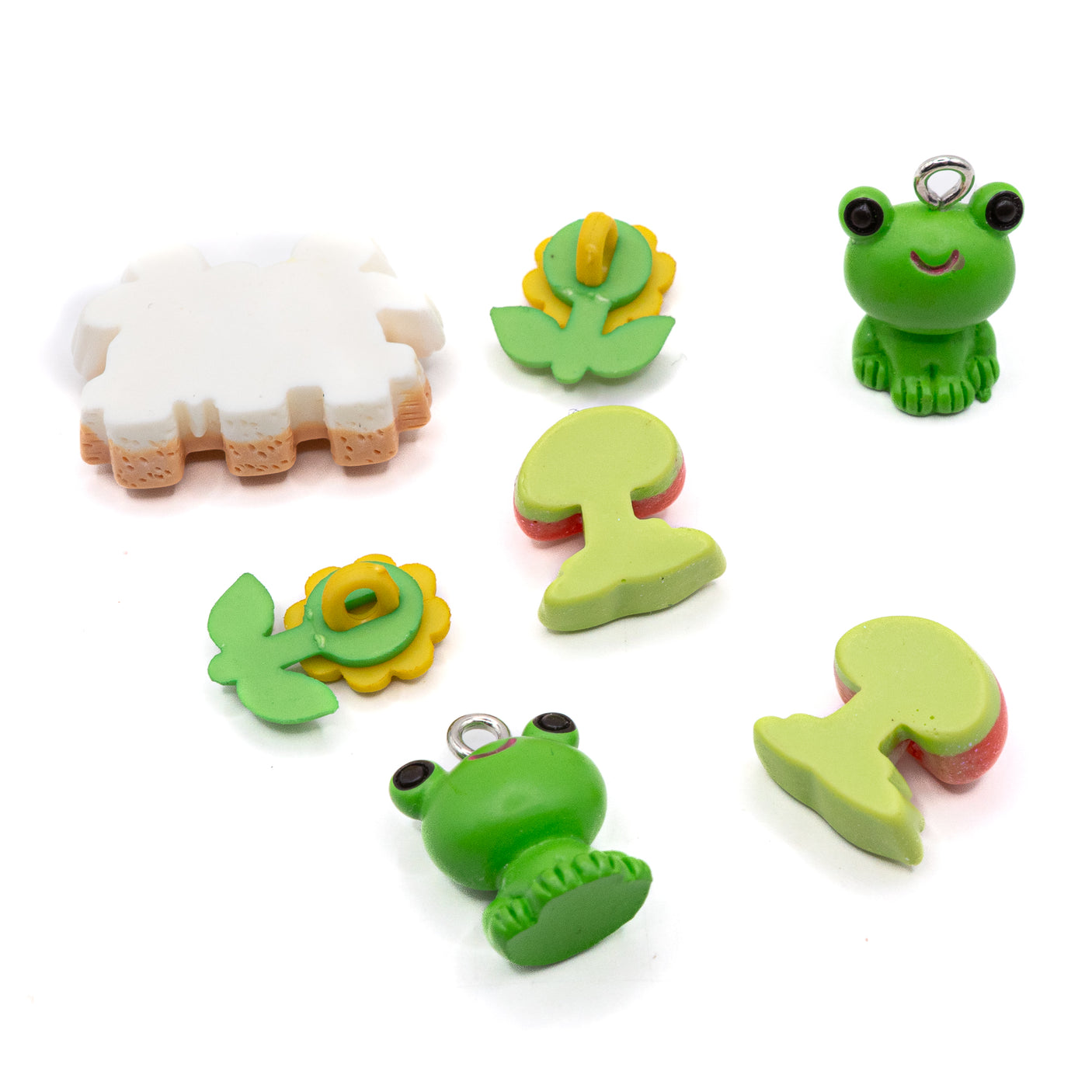This pack includes two frog charms, daisies, and toadstools in shank-back and flat-back styles. 7 pieces Includes charms, shank-back, and flat-back styles