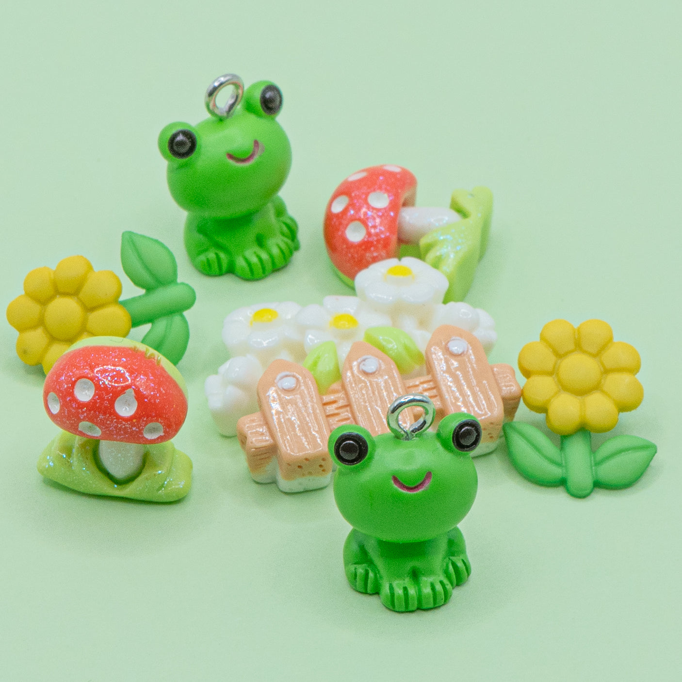 This pack includes two frog charms, daisies, and toadstools in shank-back and flat-back styles. 7 pieces Includes charms, shank-back, and flat-back styles