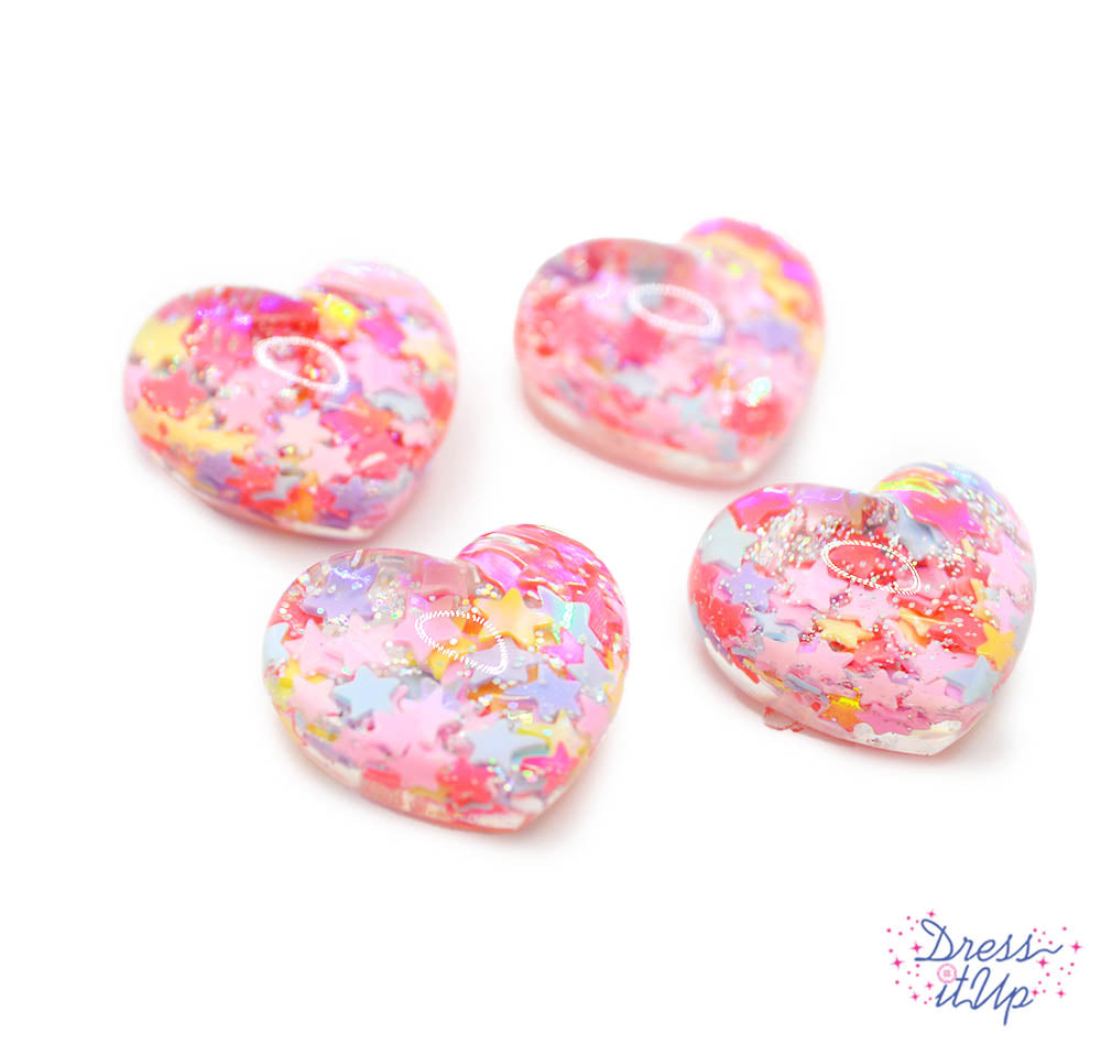 Six flat-back resin hearts filled with rainbow confetti