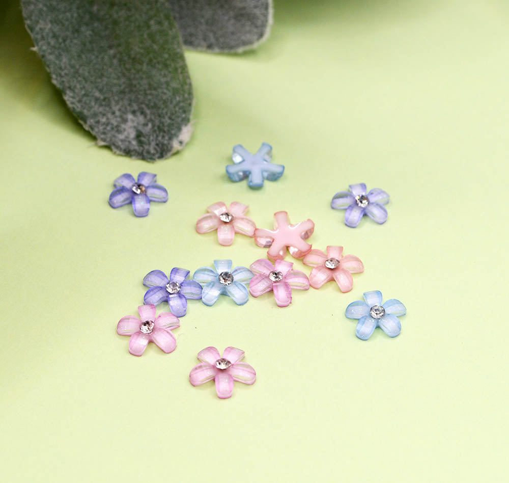 Rhinestone flowers in a purple and pink pallete for paper and wood crafts