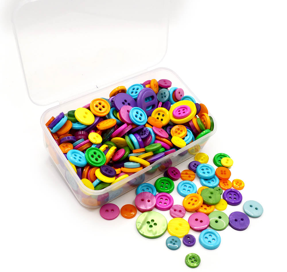 Assortment of sewing buttons in bright jewel tones in various sizes and styles.