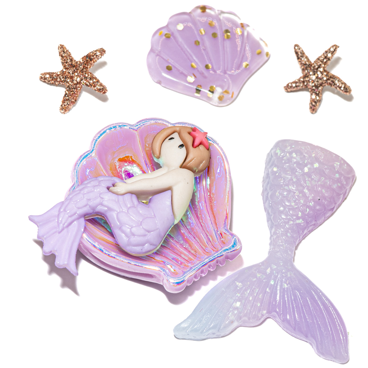 Mermaid-themed hair accessories including shells and mermaid tail on a white background.