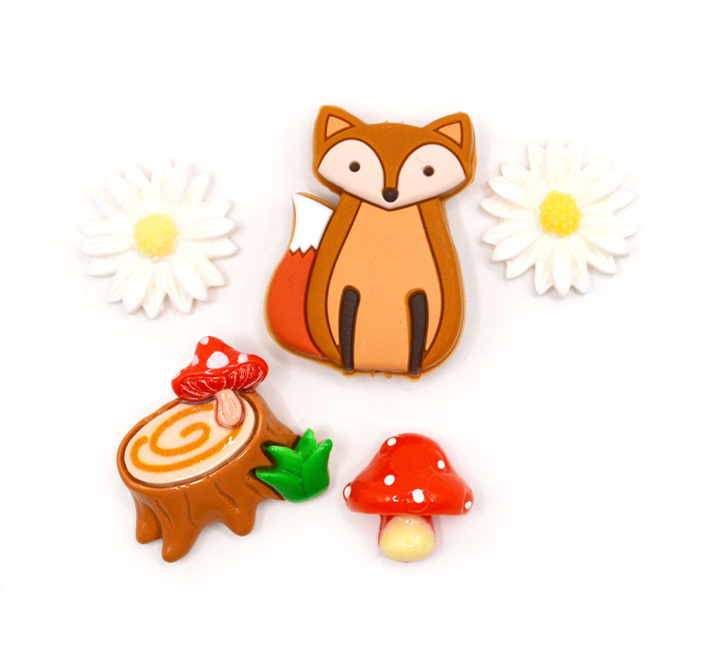 A large silicone fox bead and resin flat back woodland themed embellishments.