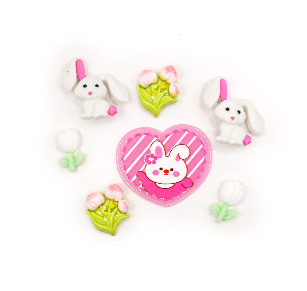 a pack of craft embellishments in pink rabbits and tulip themes