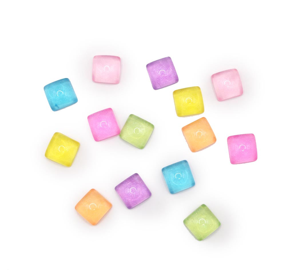 Featuring colorful squares with a glossy jelly-like finish, these embellishments are perfect for DIY crafting, scrapbooking, and decorating accessories.