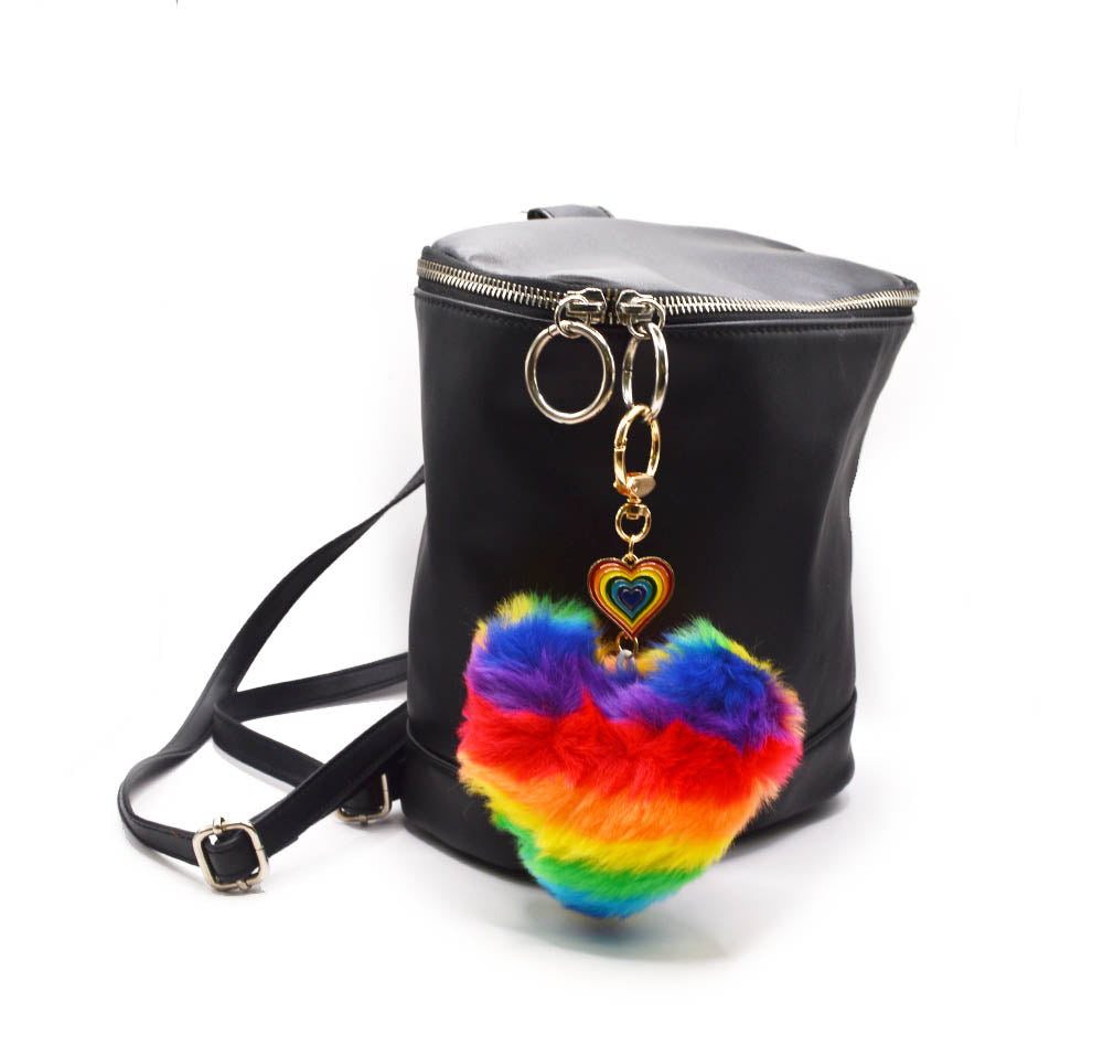 Add a faux fur heart shaped in rainbow colors to a back pack