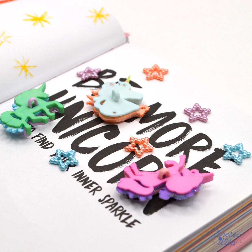 Pastel colored unicorns and beaded tiny star craft embellishments.