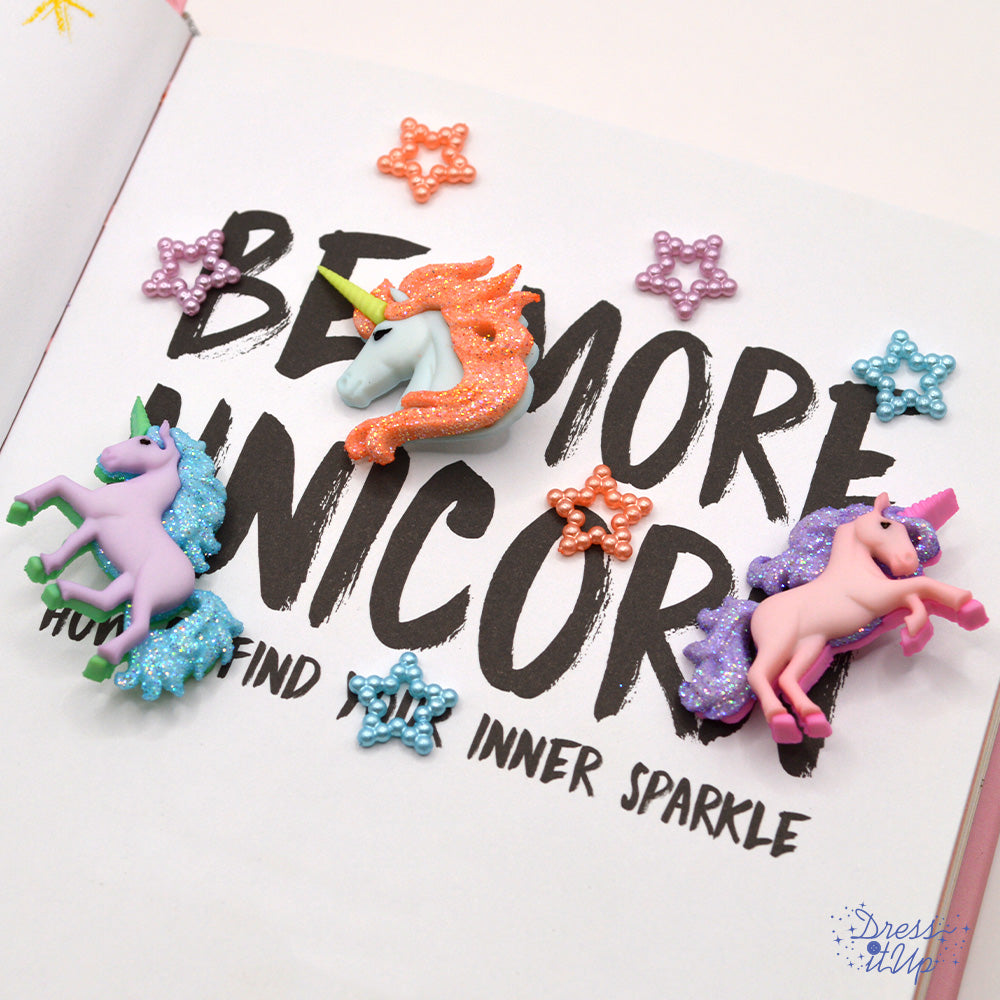 Pastel colored unicorns and beaded tiny star craft embellishments.