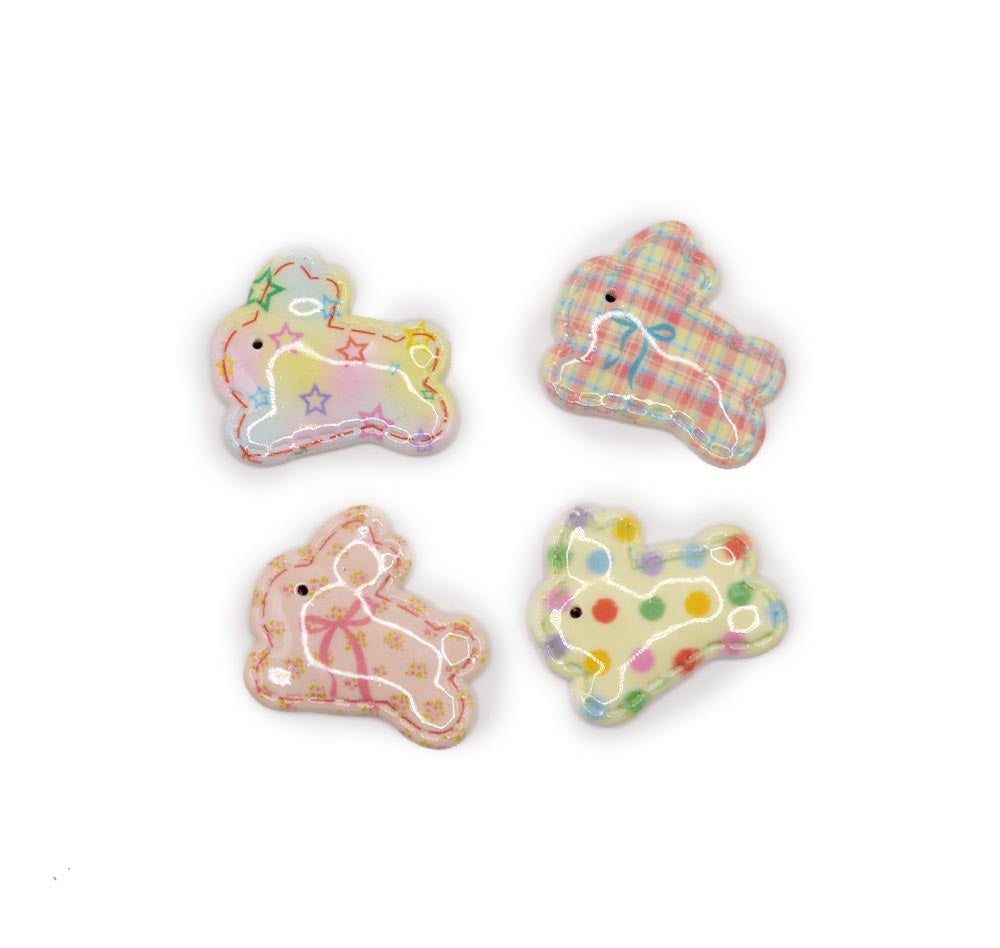 Resin rabbit embellishments with a variety of quilted patterns on a white background