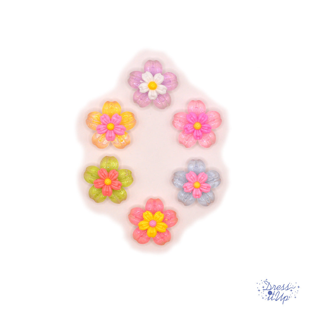 Delicate resin flowers in pastel colors, flat-back embellishments