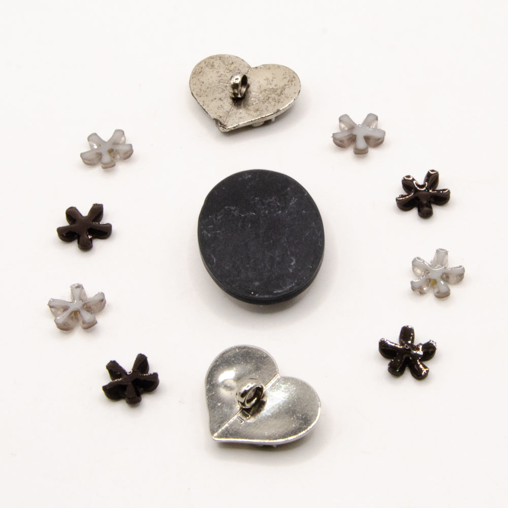 black, white, and silver metal vintage floral themed embellishment pack for crafting.