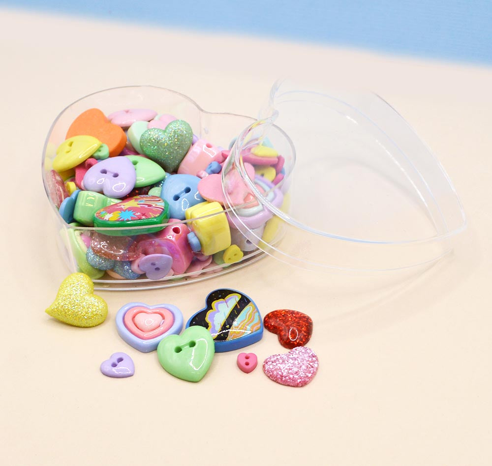 Heart shape resin flat back embellishment and sew thru buttons in a heart shape containers