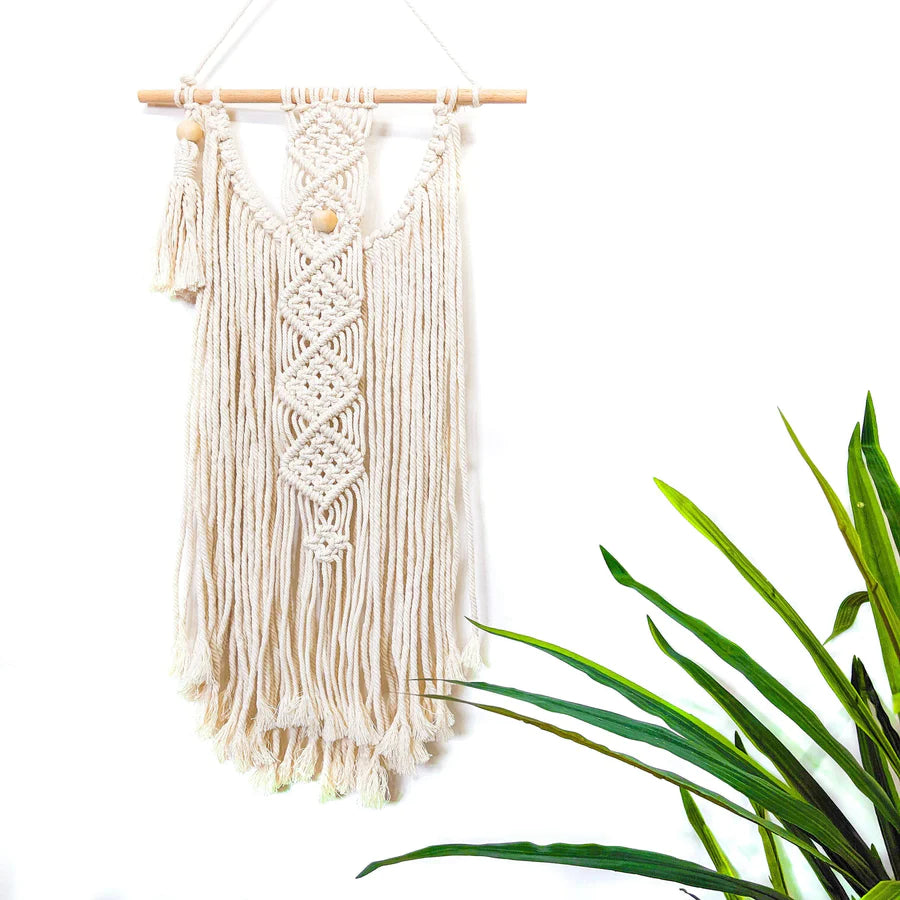 This Macrame Wall Hanging DIY Kit by Darn Good Yarn includes instructions and all materials for making your own wall art. Cotton macrame cord and wooden beads.