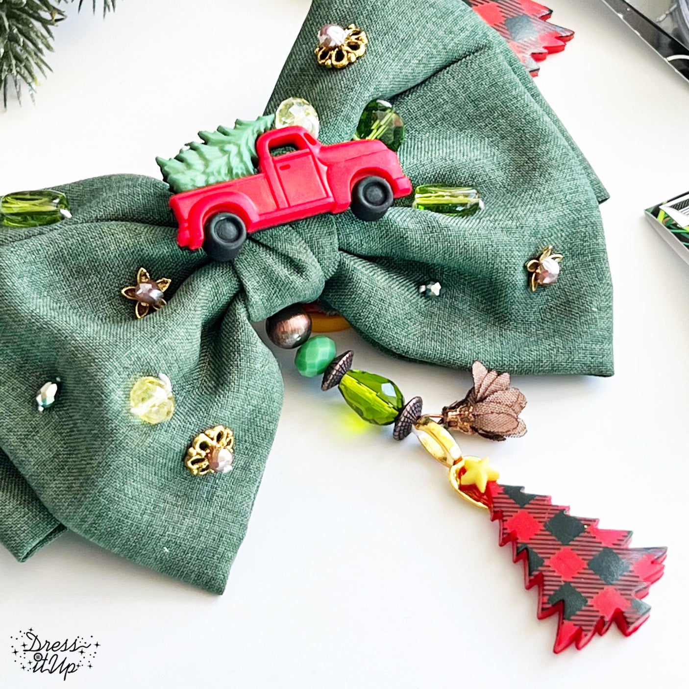 Green hair bow dressed up with Home For The Holidays button embellishments