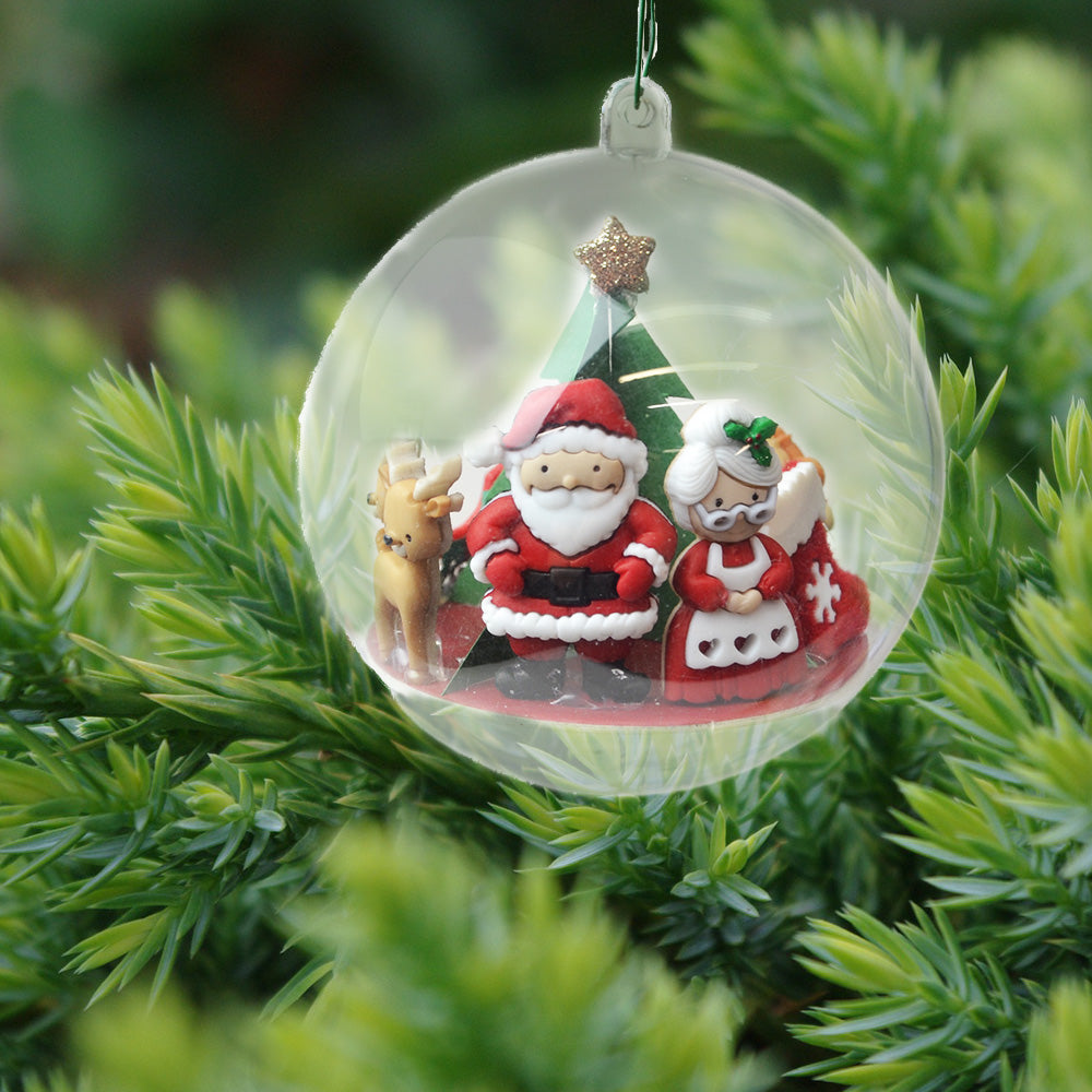 Santa, Mrs. Claus and a reindeer are featured in this Christmas ornament