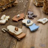 Back of nativity buttons that show they have a plastic loop for sewing to fabric christmas crafts