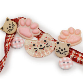 Plaid cats, paws, and sew-thru buttons for crafting