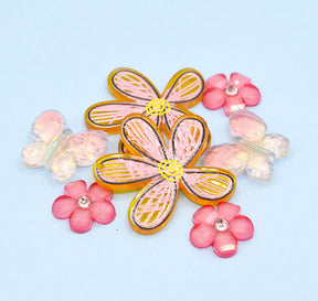 seven floral and butterfly resin craft embellishments