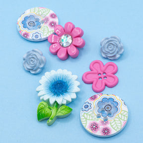  floral craft embellishment pack, featuring sew-thru wood buttons adorned with a charming pink and blue flower pattern. 