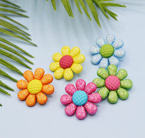Large bright glitter daisies embellishments for crafting.