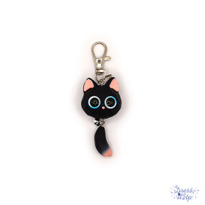 This black Opaque Resin Kitten Keychain features a charming big-eyed cat with a playful bell