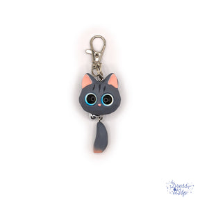 This grey opaque Resin Kitten Keychain features a charming big-eyed cat with a playful bell