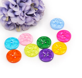 two-hole round buttons in bright colors with flower swirl centers