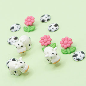 Cute cows and bright blooms are the perfect addition to your next craft! This mixed-media embellishment pack is perfect for phone charms, DIY decor, badge reels, and more.