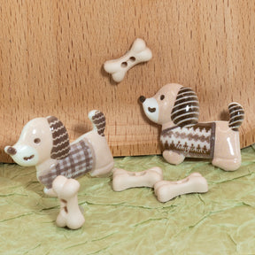 Dachshund dog craft embellishments and dog bones on a green background