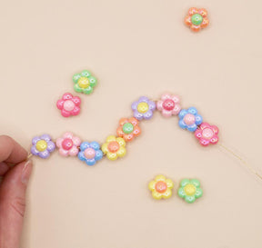 Bright pastel colored daisy beads in a light weight plastic with pearl finish for crafting