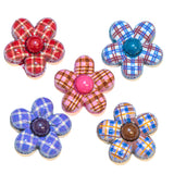 Plaid resin craft embellishments on a white background