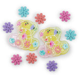 Two translucent yellow teddy bear-shaped charms decorated with colorful pressed flowers, surrounded by matching loose flower-shaped buttons on a white background.