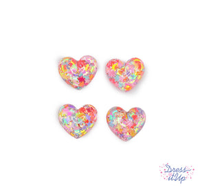 Six flat-back resin hearts filled with rainbow confetti