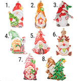 Eight Christmas gnome ornaments shown on a white background with numbered labels 1 through 8. The ornaments feature different festive designs including a gnome with a tree, a gnome in a sleigh, a gnome with a red hat and scarf, a gnome with a green hat and gifts, a gnome with a red hat and bell, a gnome with a reindeer head, a gnome holding candy canes and holly, and a gnome beside a decorated Christmas tree.