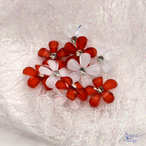 Red and white flowers with a rhinestone center bring sparkle to crafting projects
